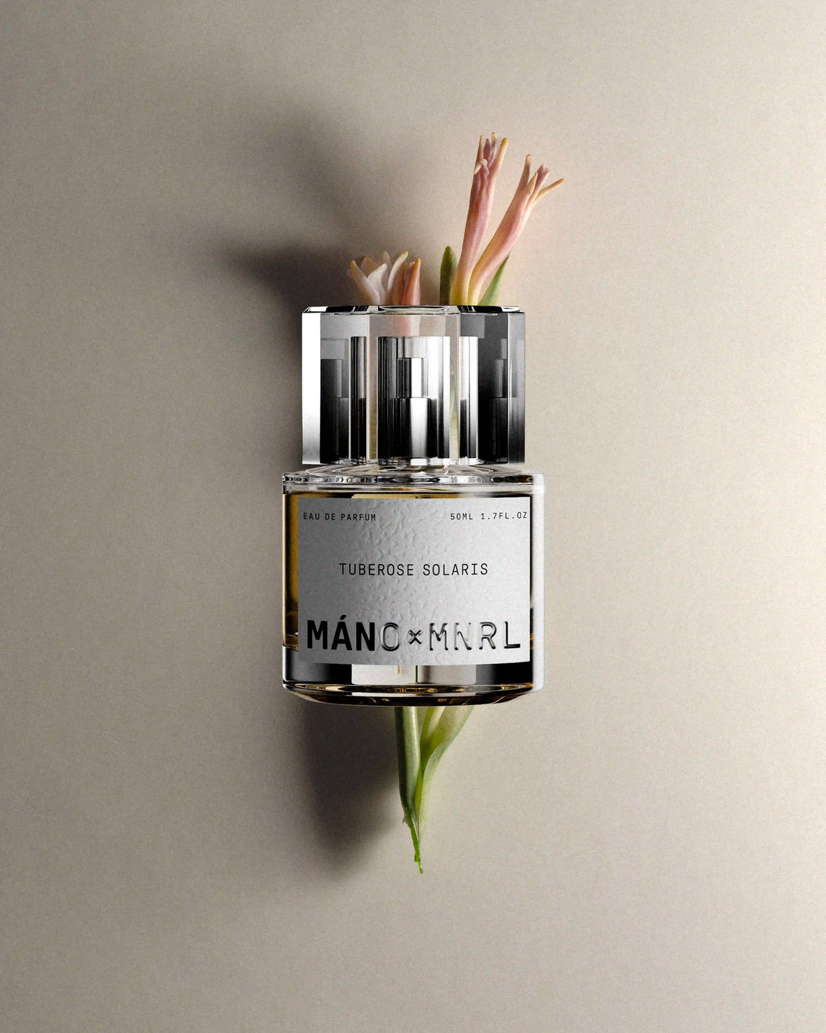 Tuberose Solaris bottle with hero ingredient